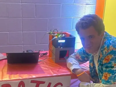 The assembled CandyBot machine on display at the school robotics table